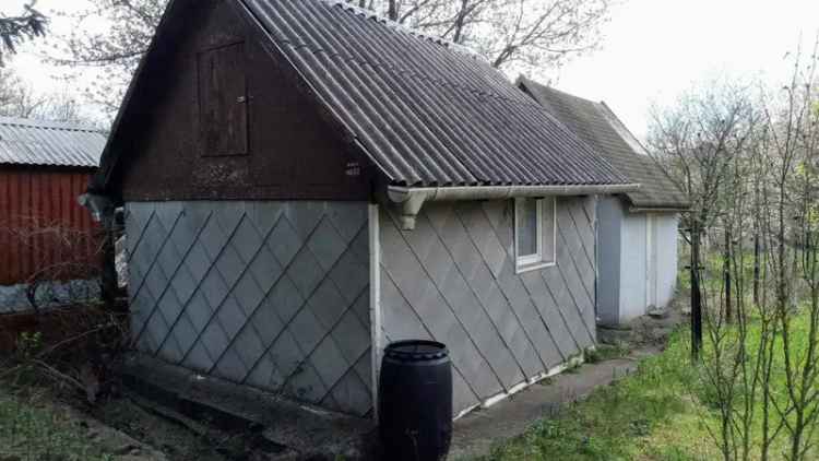Öreghegyi úti telek kis házikóval - Turul